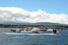 Spindrift winner of the Lisbon to Dun Laoghaire leg crashes out of the La Route des Princes in Dublin bay in style as she capsizes ! members of the crew attend to the injured as reccue boats attend © Michael Chester